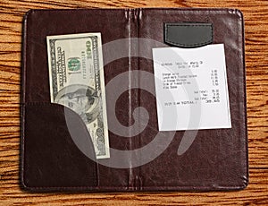 Folder with bill and money
