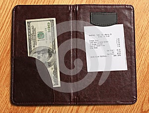 Folder with bill and money