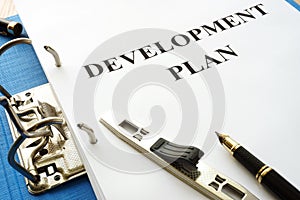Folder with development plan. photo