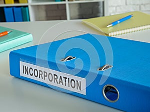 Folder with documents for incorporation on the desk.