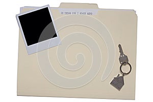 Folder with house key and photo