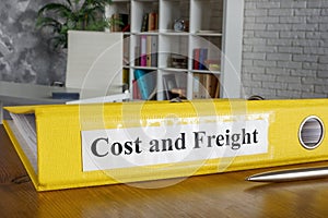 Folder with label Cost and Freight CFR in an office.