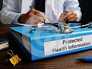 Folder with protected health information PHI as part of HIPAA rules. photo