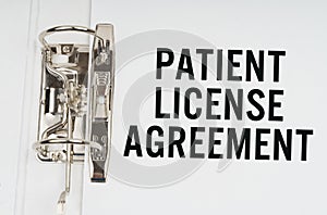 In the folder under a paper clip there is a white sheet with the inscription - Patient license agreement