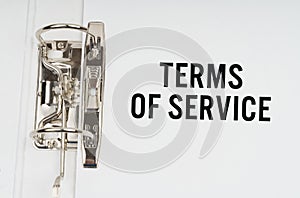 In the folder under a paper clip there is a white sheet with the inscription - Terms of service