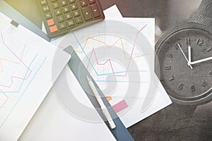 Folders with documents and calculator on office table