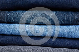 Foldet jeans in pile background