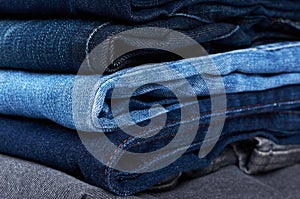 Foldet jeans in pile background
