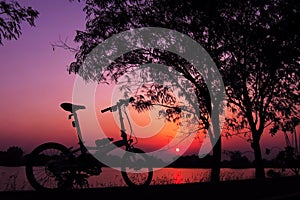 Folding Bike at Sunset Silhouette