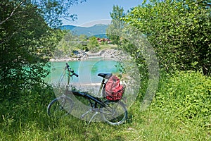 folding bike beside turquoise Isar river, route from Bad Tolz to Lenggries