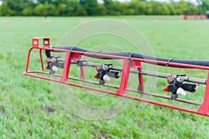 Folding boom at wheat field close up