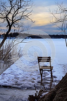 Folding chair on frozen lake