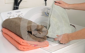 Folding clean towels and laundry