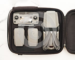 Folding drone, accessories, case, topview flatlay photo