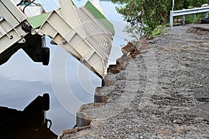 Folding metal gangway descending from the ferry to the ground