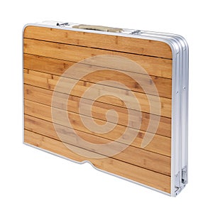 Folding picnic table, folded into a suitcase shape, on a white background