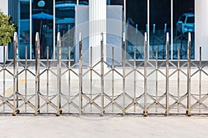 Folding retractable fence on casters. barrier on casters. Sliding gates on rollers. Pedestrian barrier. Barricade Gate. Chrome bar