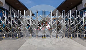 Folding retractable fence on casters.  barrier on casters. Sliding gates on rollers. Pedestrian barrier. Barricade Gate. Lockdown