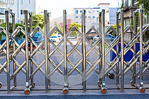 Folding retractable fence on casters. Chrome barrier on casters. Sliding gates on rollers. Pedestrian barrier. Barricade Gate