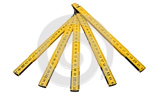 Folding ruler isolated, yellow carpenter`s rule with centimeters numbers.