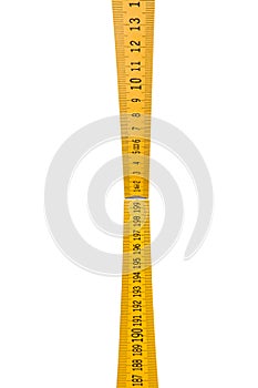 Folding ruler isolated, yellow carpenter`s rule with centimeters numbers.