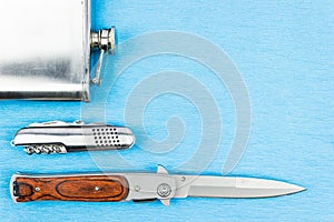 Folding travel knife and a metal bottle