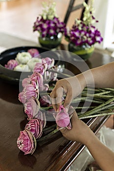 folding white and red lotus flowers arrangement in cambodia