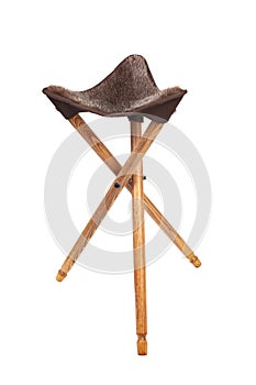 Folding wooden hunting stool tripod isolate on white background. Three-legged camping chair