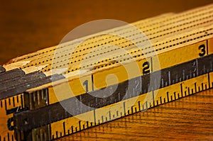 Folding wooden ruler for carpentry and construction