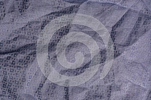 Folds of blue fabric textured background close up