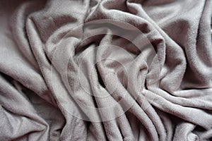 Folds of grey viscose fabric from above