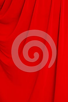 Folds of red material as background photo