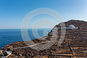 Folegandros island, Greece, Cyclades. Panagia Virgin Mary Church and long zigzag road