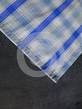 Folk pattern, tablecloth on stone table. Checkered tablecloth. S