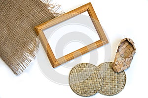 Folk style sceen with yellow wooden frame and straw handicraft