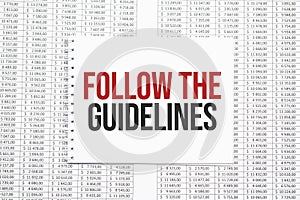 FOLLOW THE GUIDELINES text on paper with calculator,magnifier ,pen on the graph background