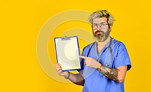 Follow my prescription. mature bearded nurse holding clipboard. medical doctor use stethoscope. therapist in uniform at