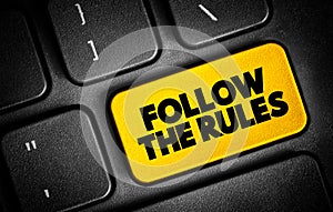 Follow The Rules text button on keyboard, concept background