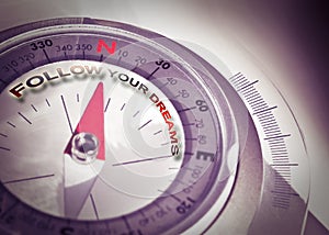 Follow your dreams - concept image with navigational compass photo