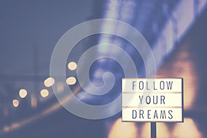 Follow Your Dreams text in a lightbox.