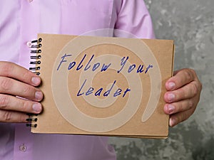 Follow Your Leader sign on the piece of paper