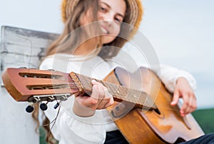 follow your own style. feel the inspiration. cheerful kid with acoustic guitar.