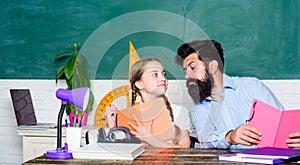 Following example. Girl pupil study with bearded teacher. Studying methods for children. School education. Extra classes