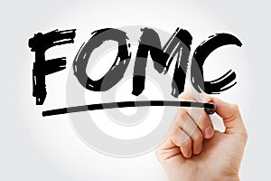 FOMC - Federal Open Market Committee acronym with marker, business concept background