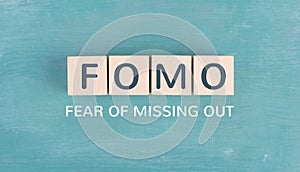 FOMO acronym for fear of missing out, social media and lifestyle concept, regret and depression, state of mind