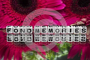 Fond memories text with flowers