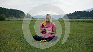 Fondling the sunflower in the nature