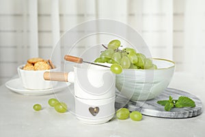Fondue pot and products on table