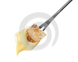 Fondue stick with cheese covered piece of bread on white background