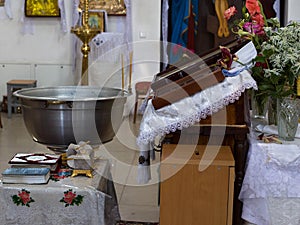 Font and Bible in the church, the sacrament of baptism